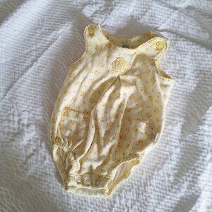 carter's newborn onesie with flower on front